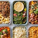 A neatly organized weekly meal prep spread, symbolizing healthy meal planning and preparation.